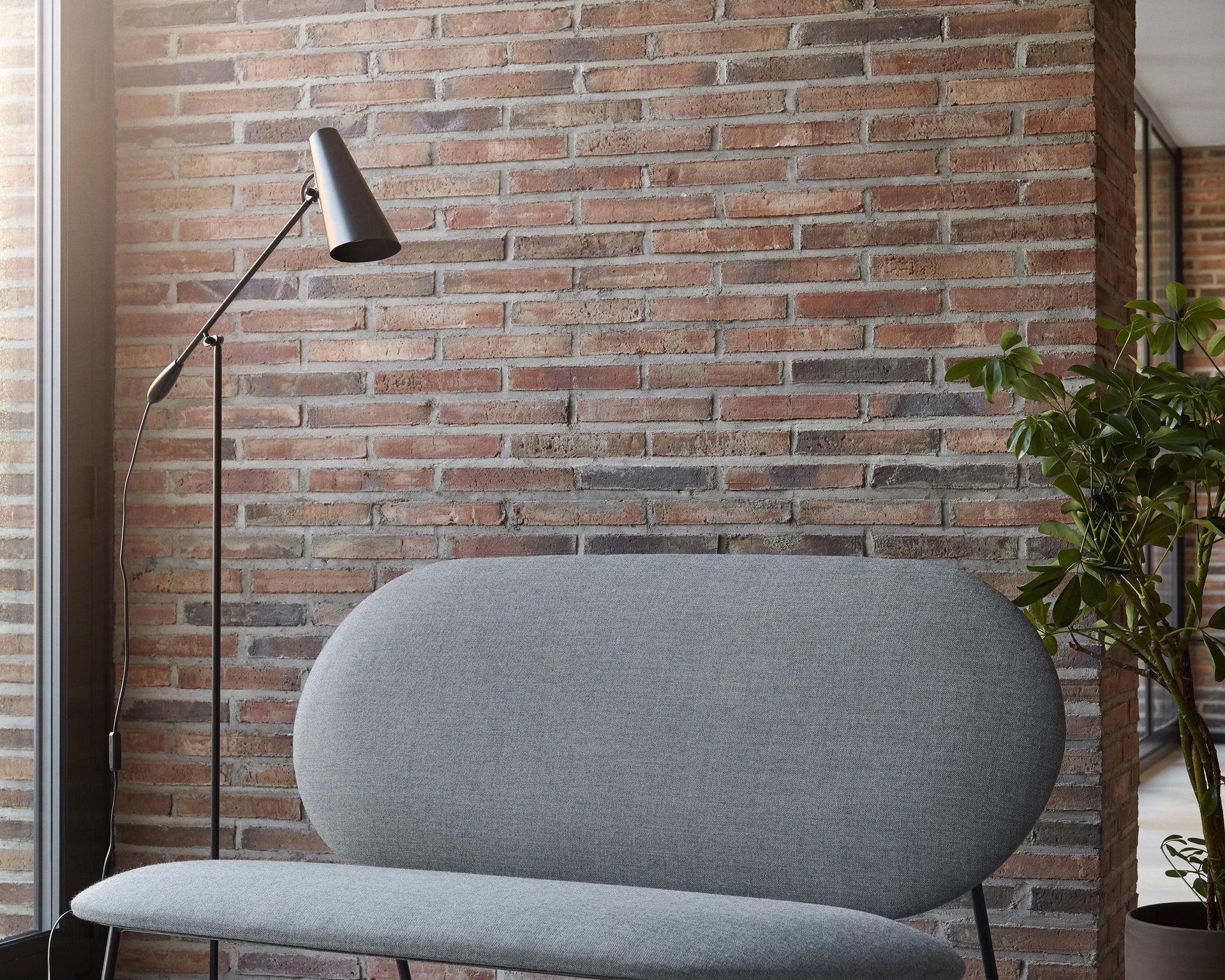 Oblong sofa grey closer Photo Chris Tonnesen